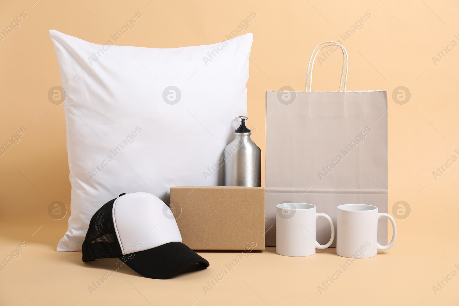 Photo of Different blank items for branding on beige background. Mockup for design