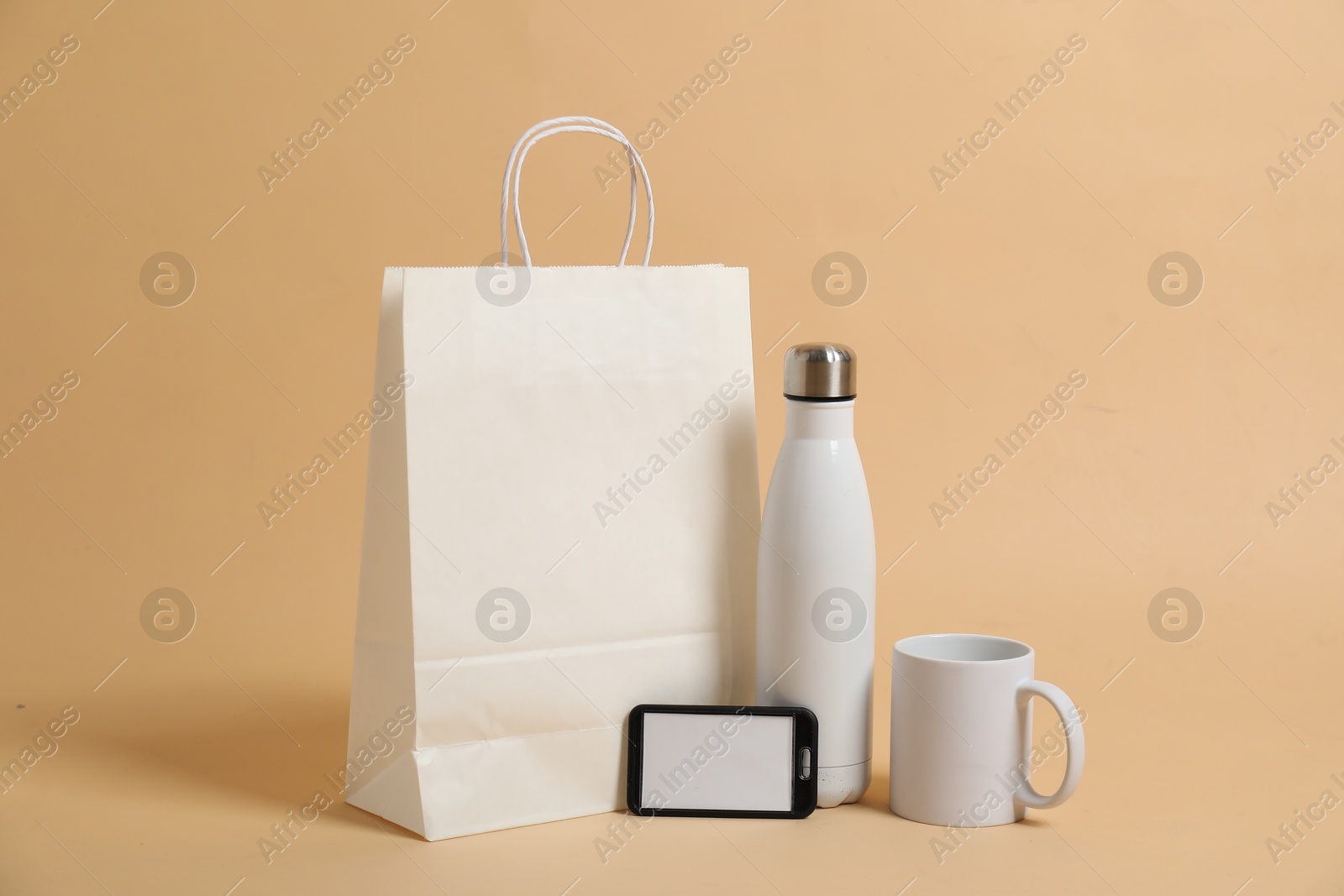 Photo of Different blank items for branding on beige background. Mockup for design