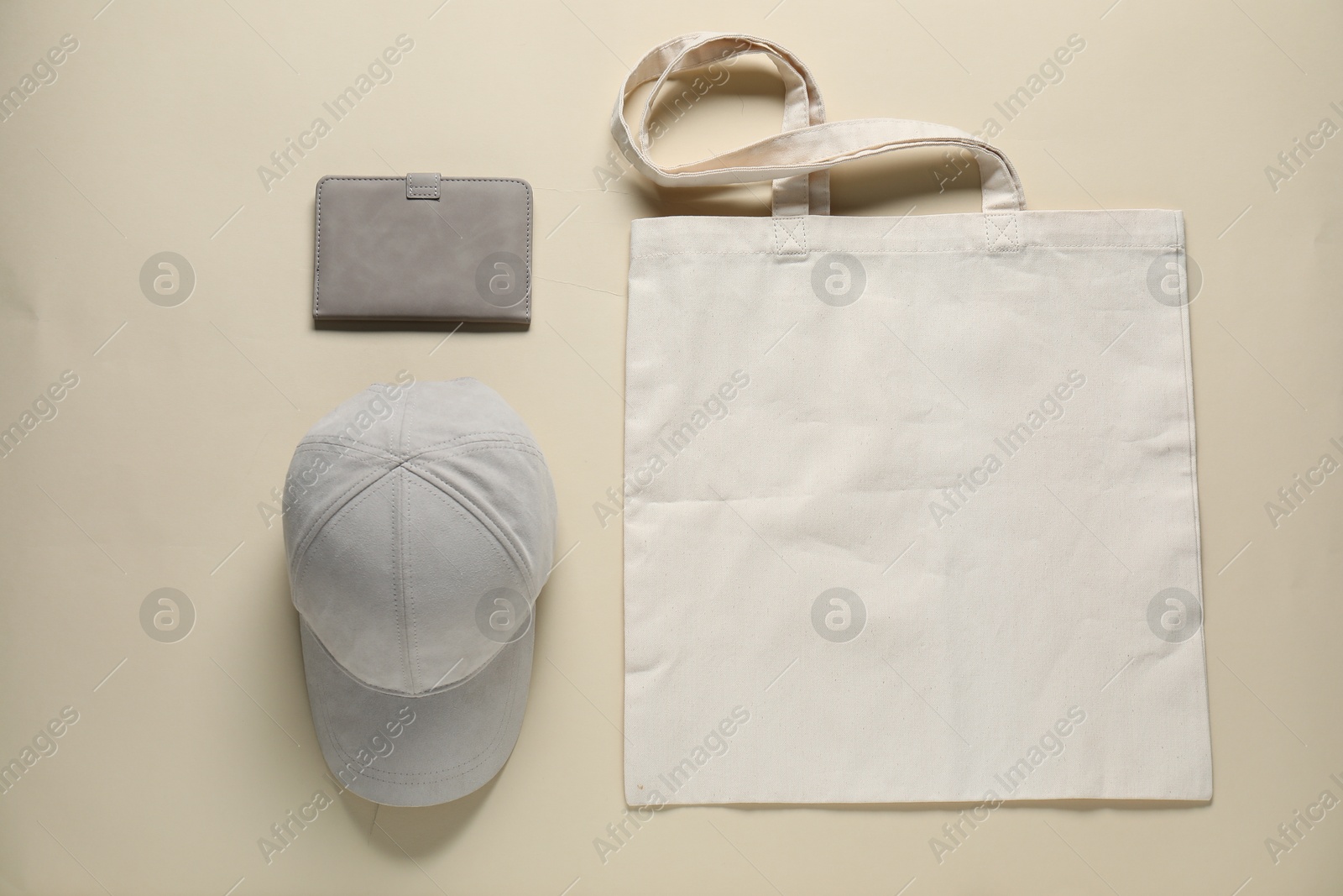 Photo of Different blank items for branding on beige background, flat lay. Mockup for design