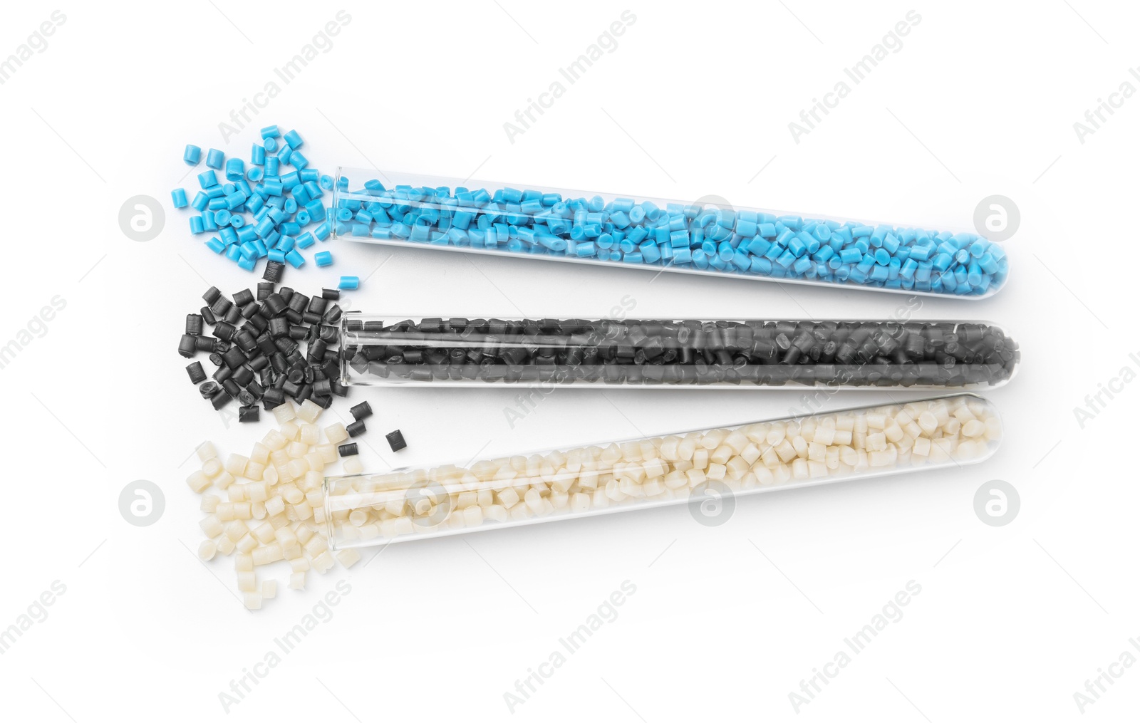 Photo of Colorful plastic granules in test tubes isolated on white, top view