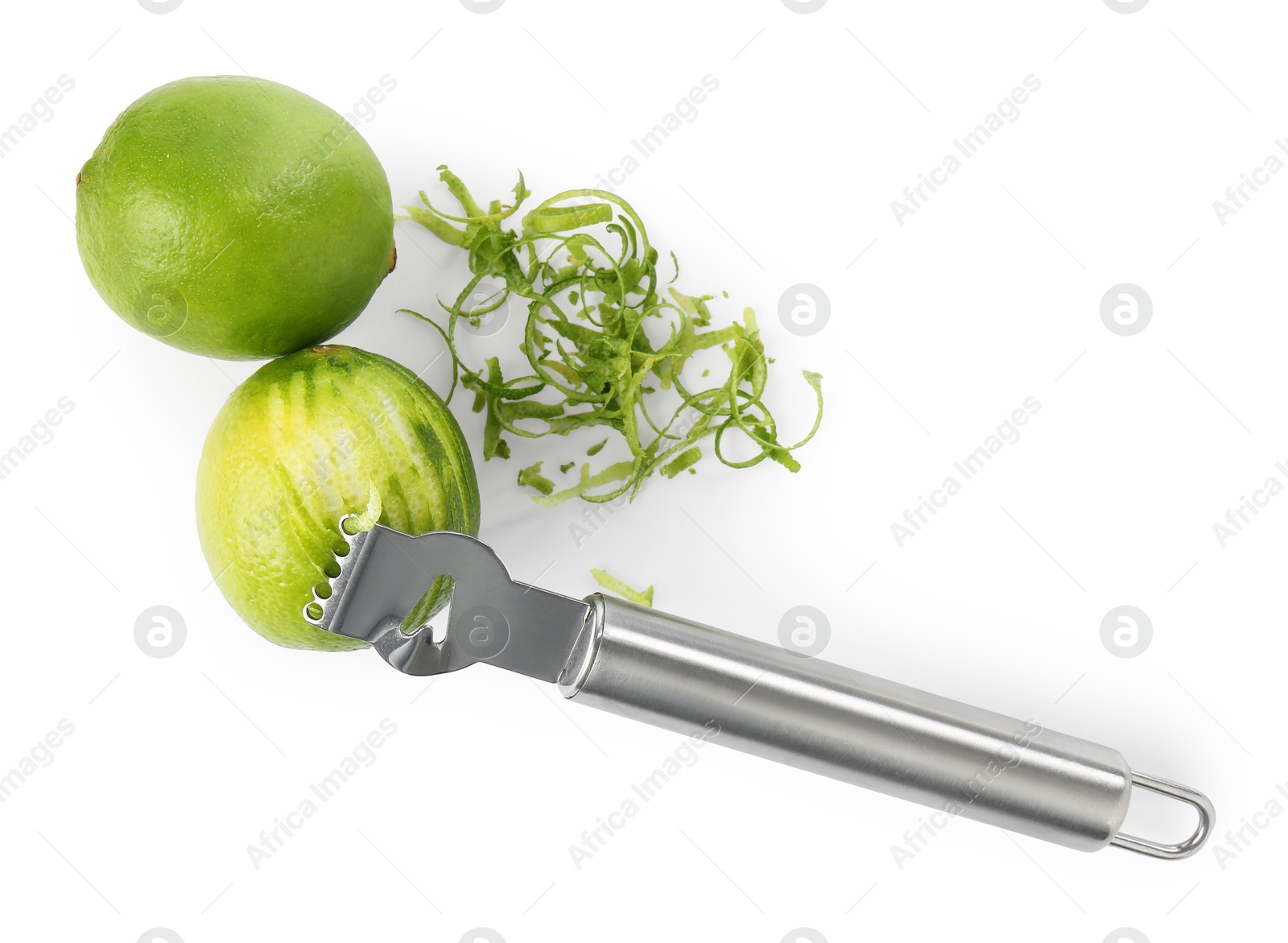 Photo of Lime zest, fresh fruits and zester tool isolated on white, top view