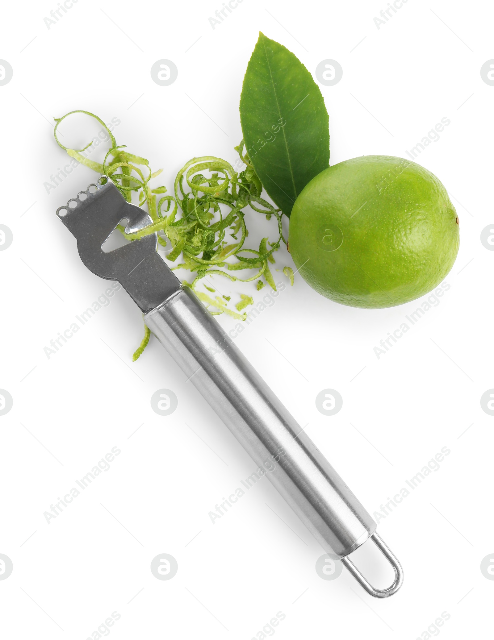 Photo of Lime zest, fresh fruit and zester tool isolated on white, top view