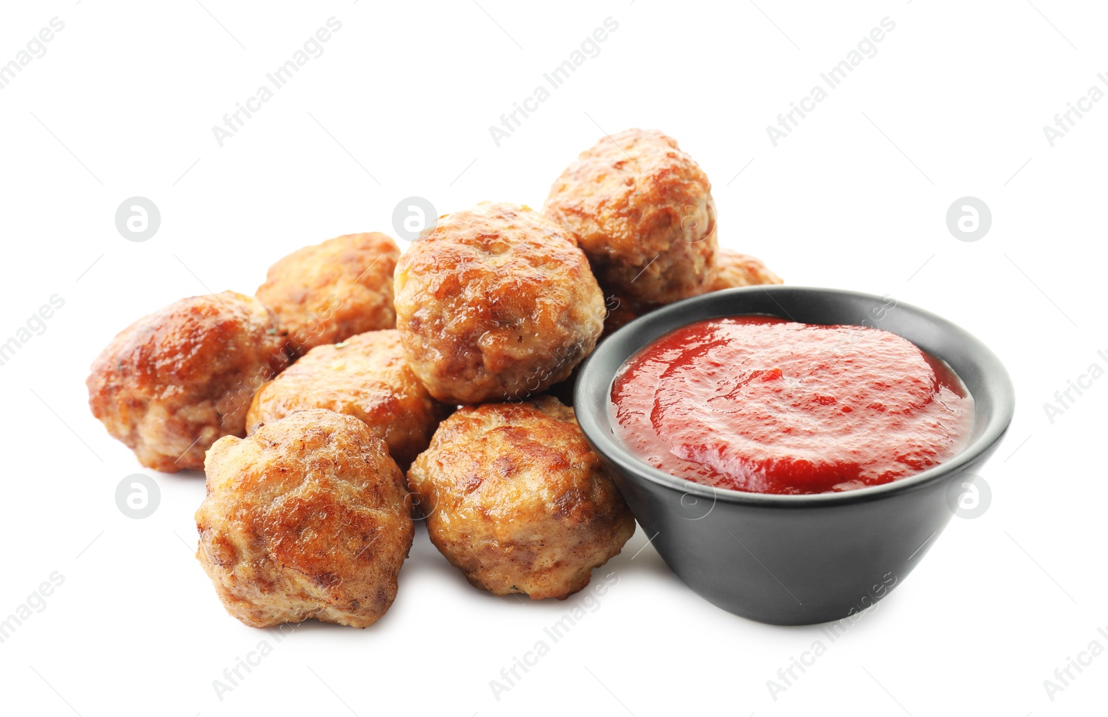 Photo of Pile of delicious meatballs and bowl with ketchup isolated on white