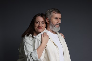 Photo of Daughter and her father on dark background