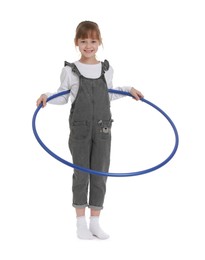 Photo of Cute little girl exercising with hula hoop on white background