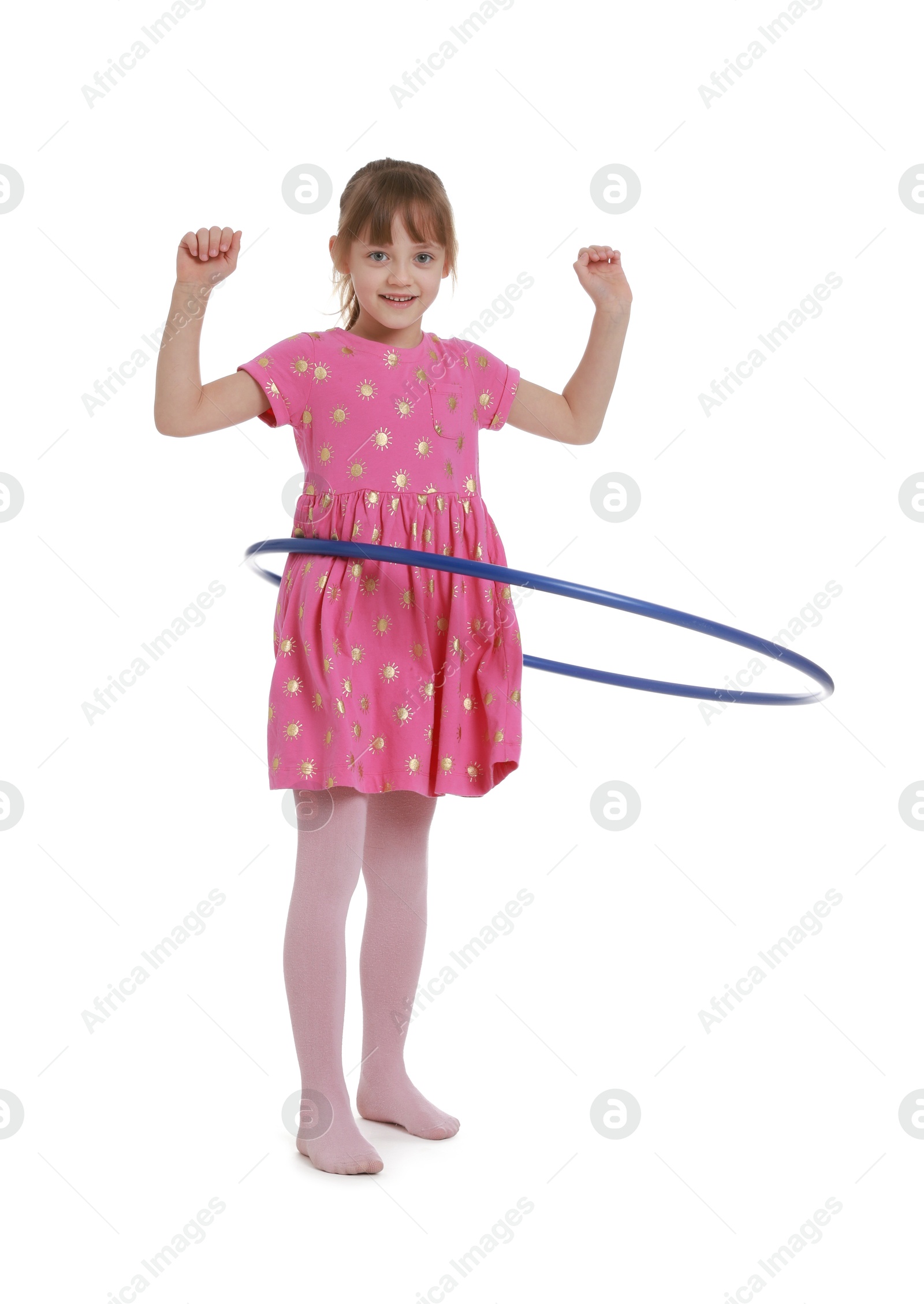 Photo of Cute little girl exercising with hula hoop on white background