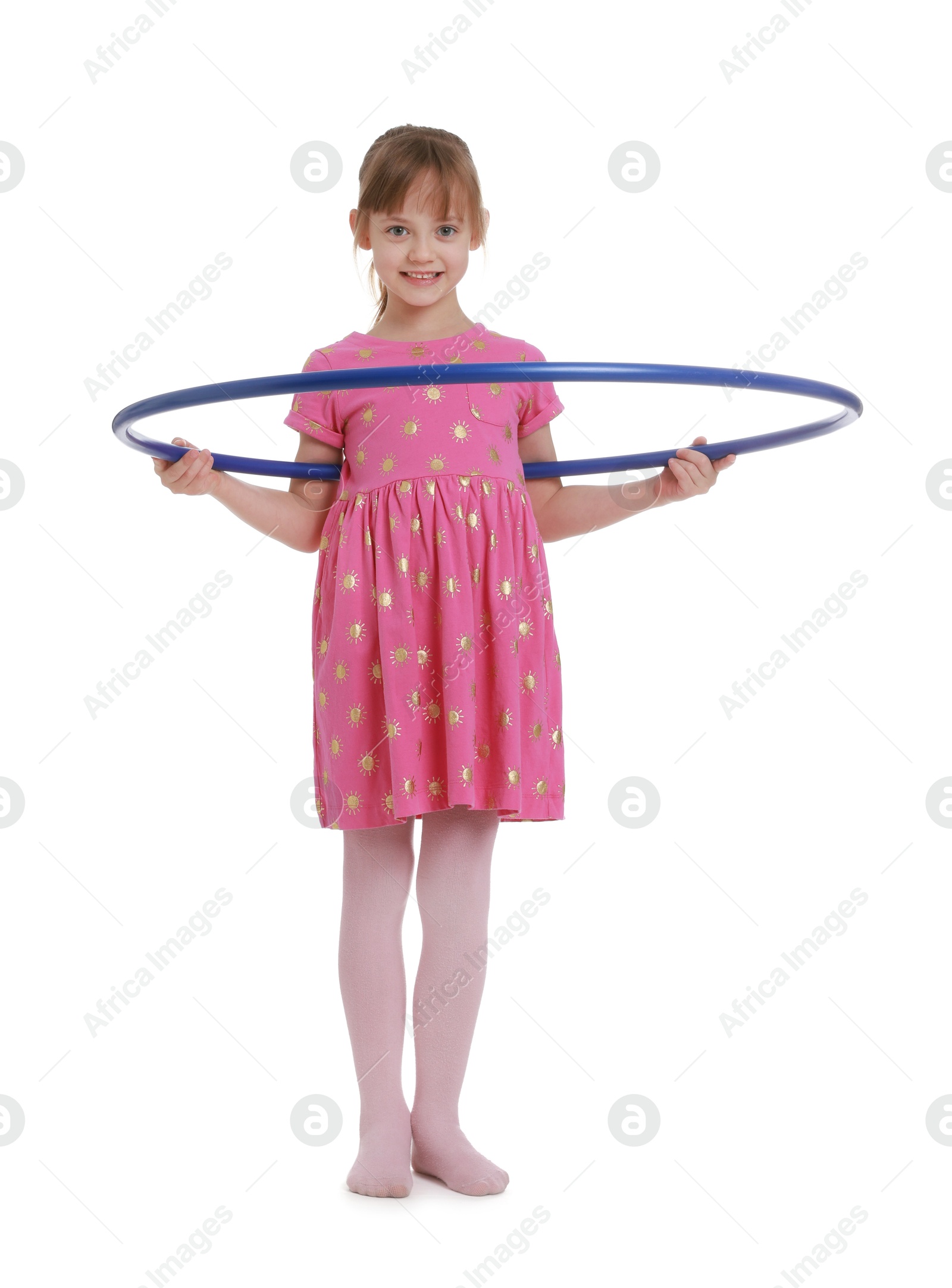 Photo of Cute little girl exercising with hula hoop on white background