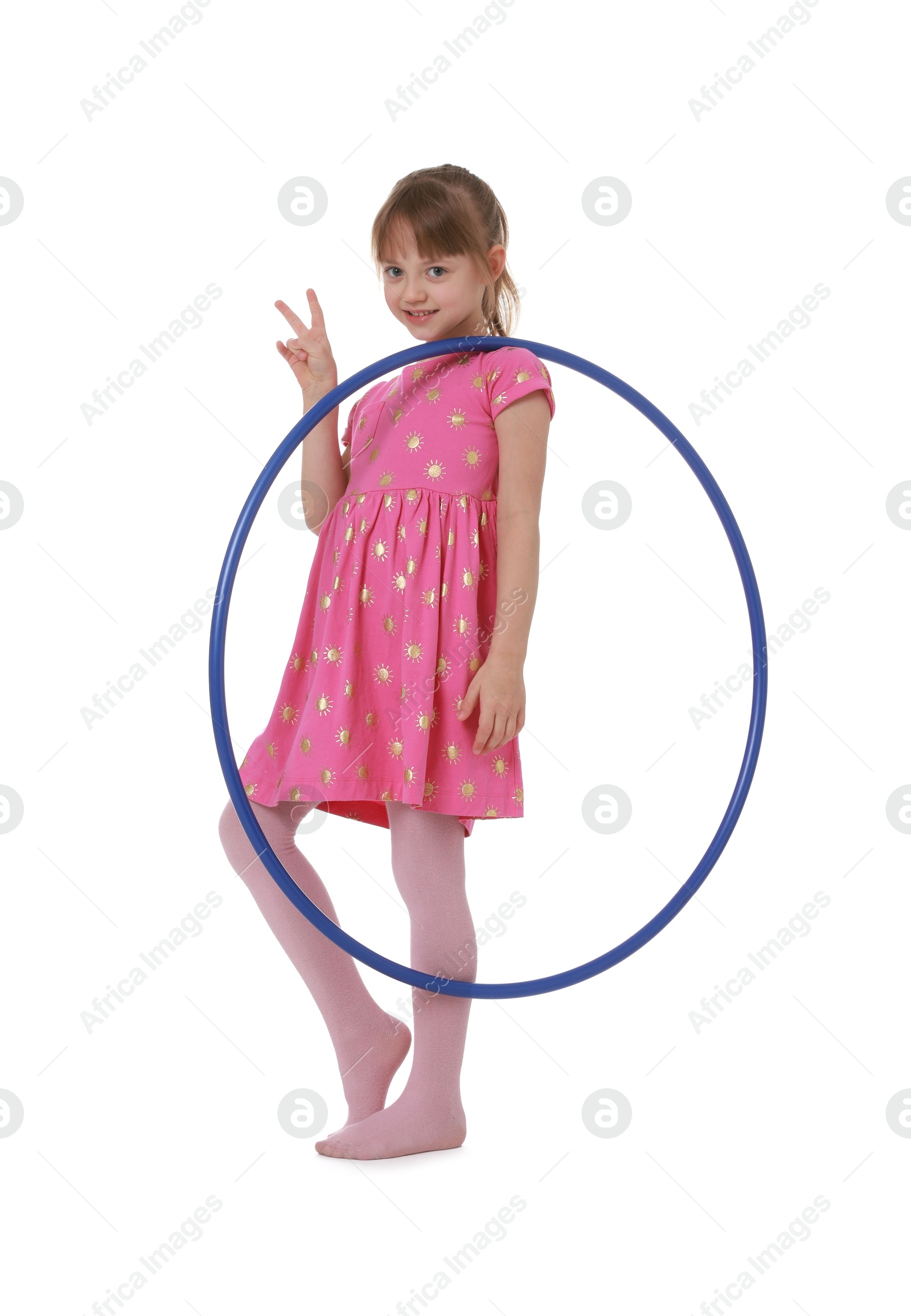 Photo of Cute little girl with hula hoop showing V-sign on white background