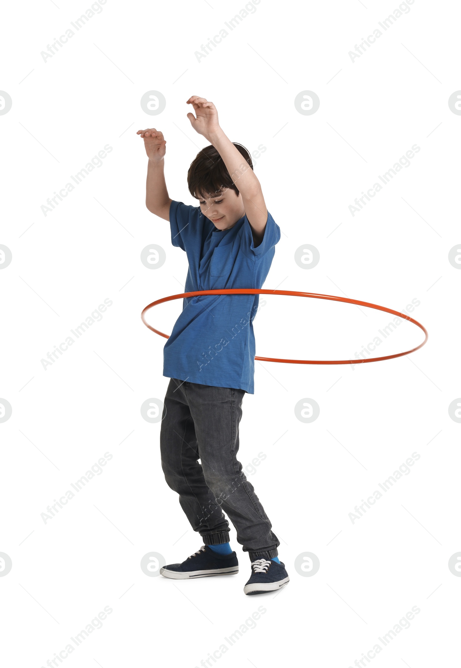 Photo of Boy exercising with hula hoop on white background