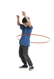 Photo of Boy exercising with hula hoop on white background