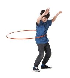 Photo of Boy exercising with hula hoop on white background