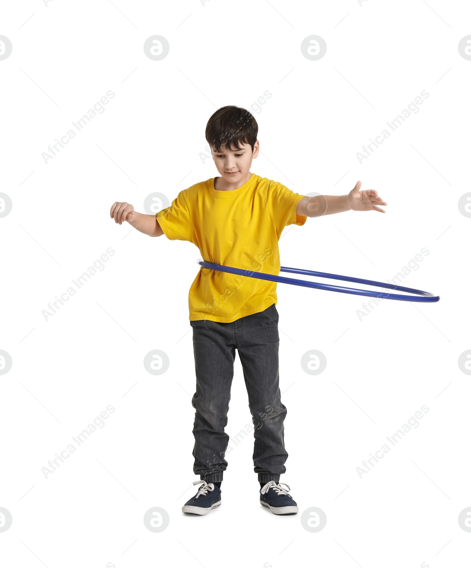 Photo of Boy exercising with hula hoop on white background