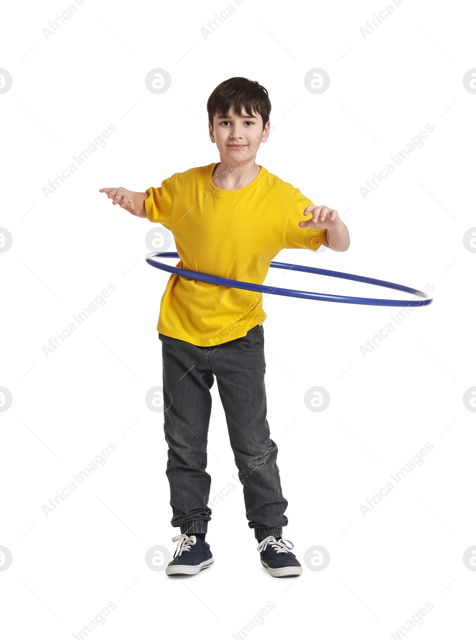 Photo of Boy exercising with hula hoop on white background