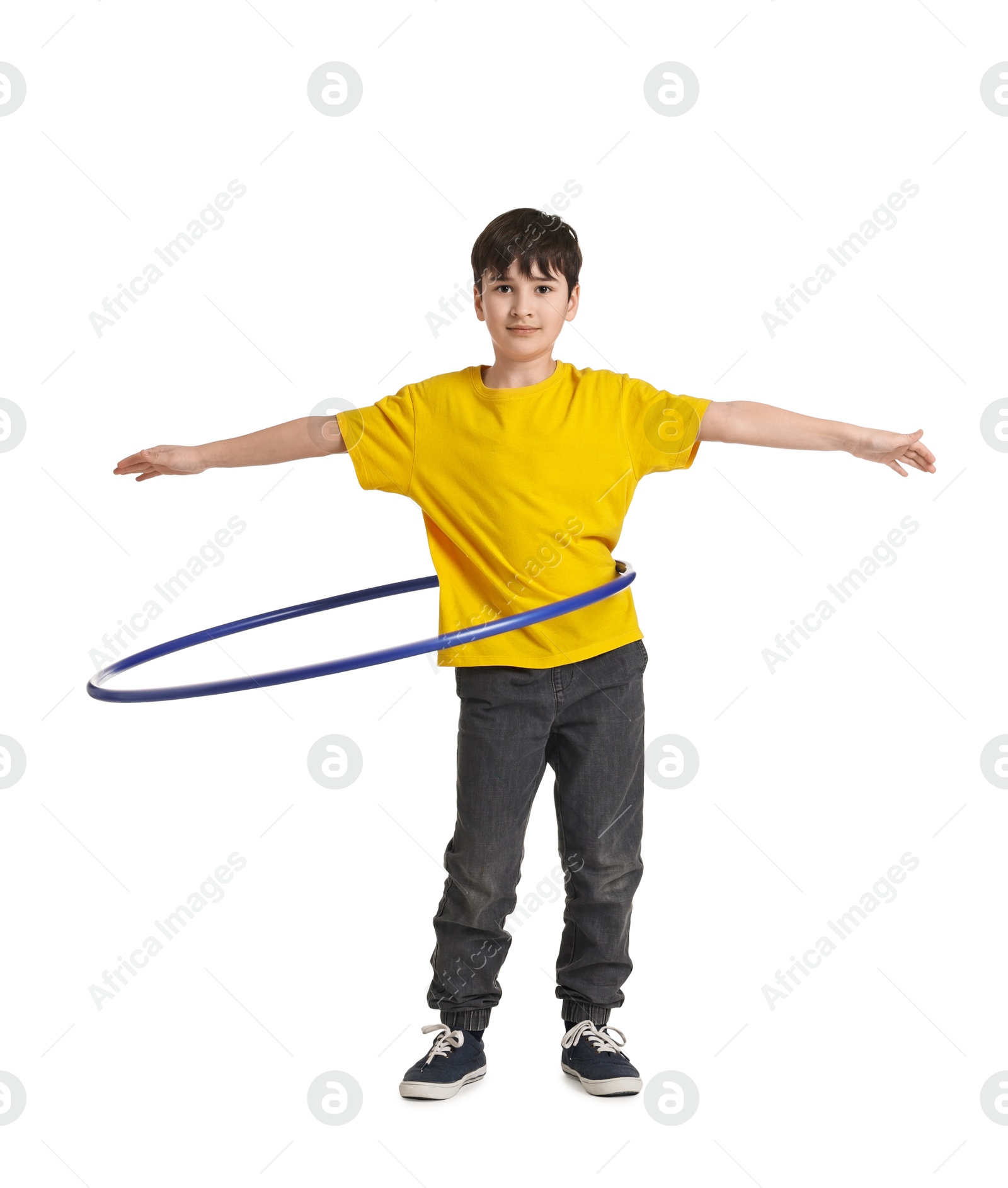 Photo of Boy exercising with hula hoop on white background