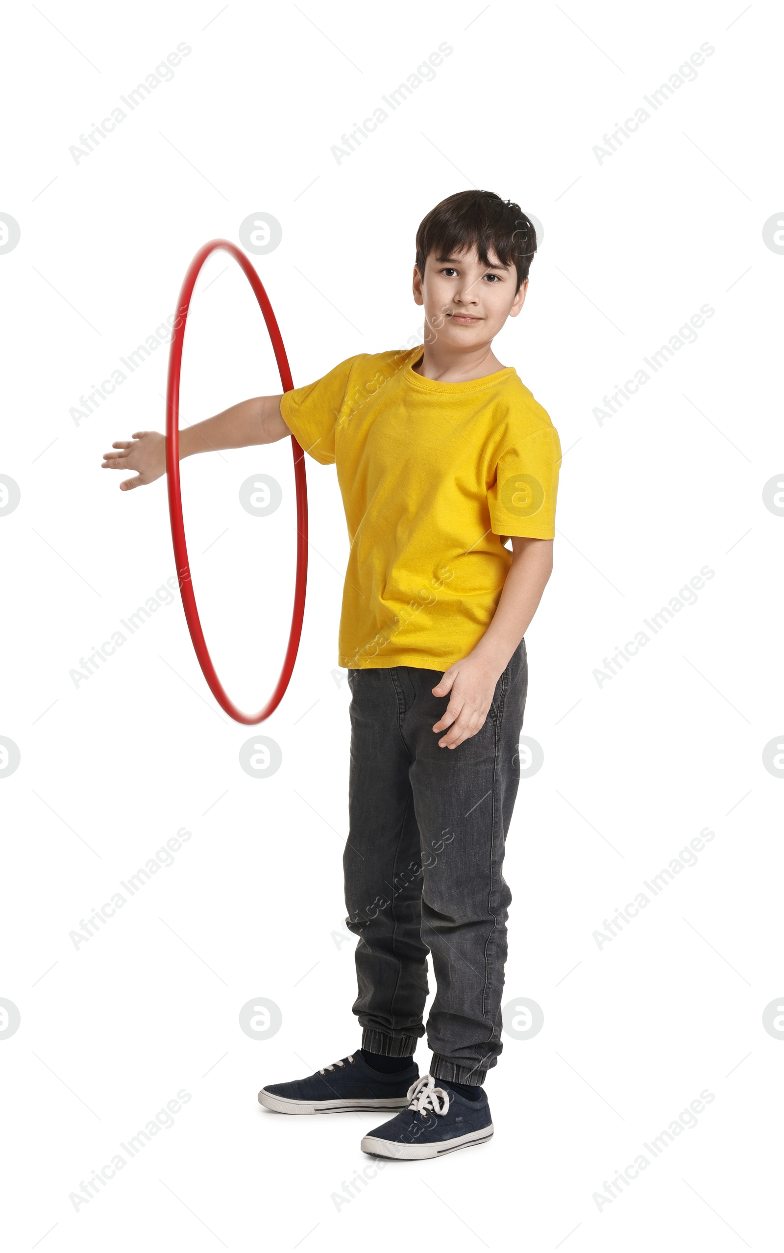 Photo of Boy exercising with hula hoop on white background