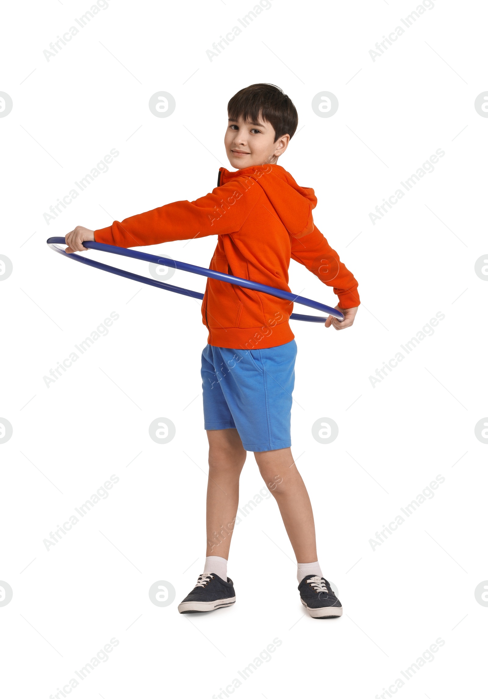 Photo of Boy exercising with hula hoop on white background