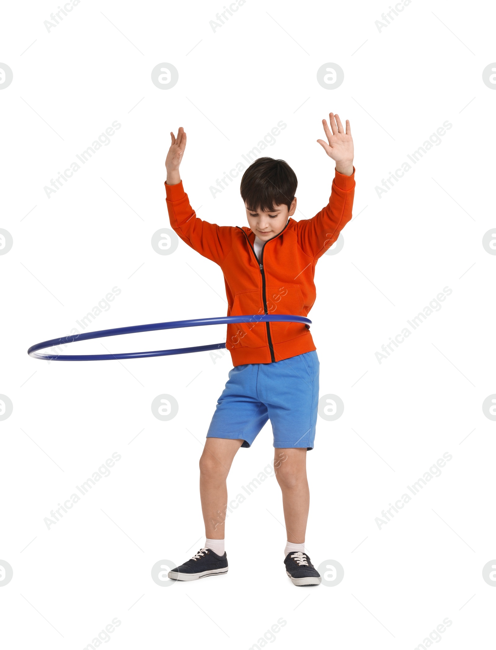 Photo of Boy exercising with hula hoop on white background