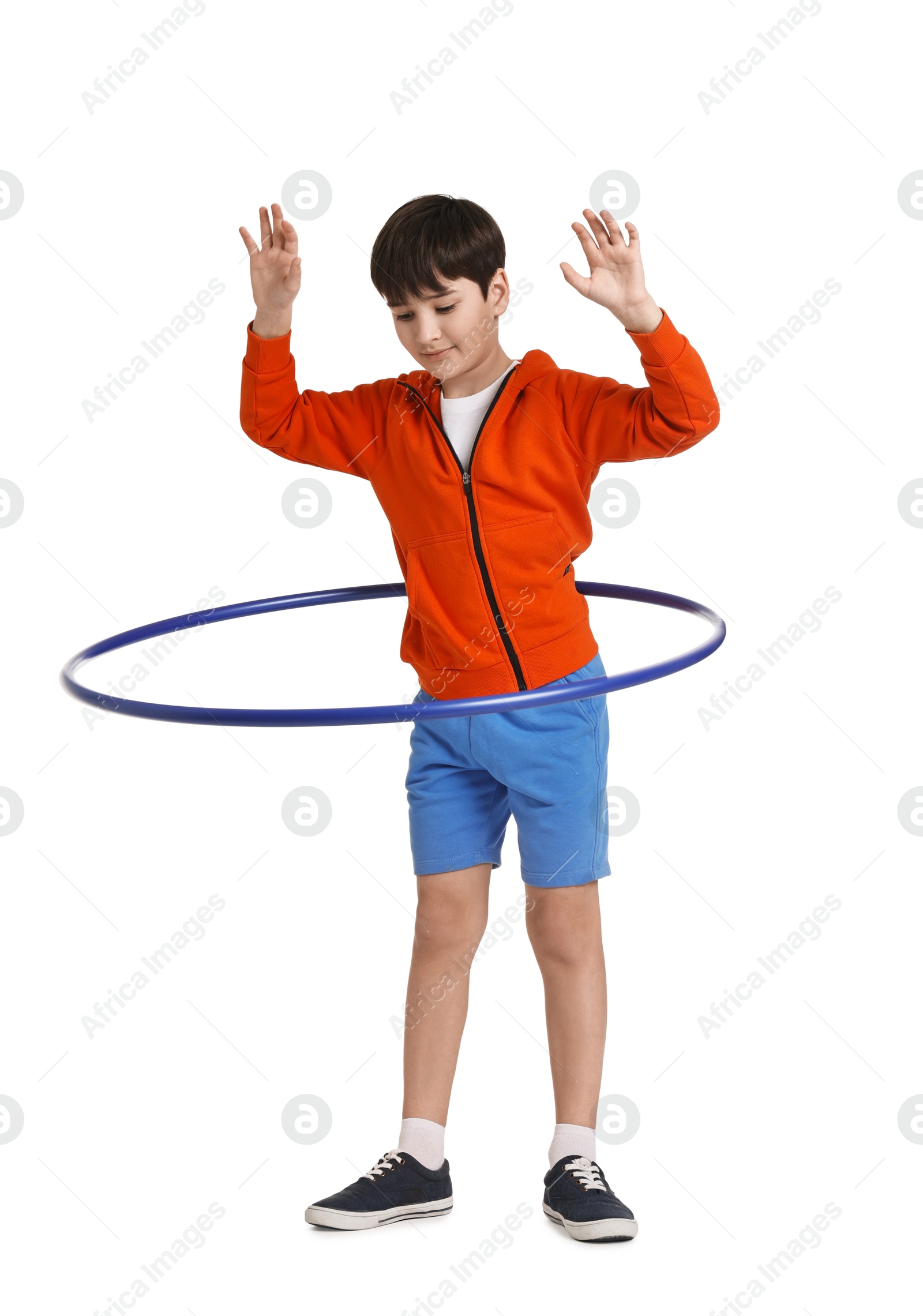 Photo of Boy exercising with hula hoop on white background