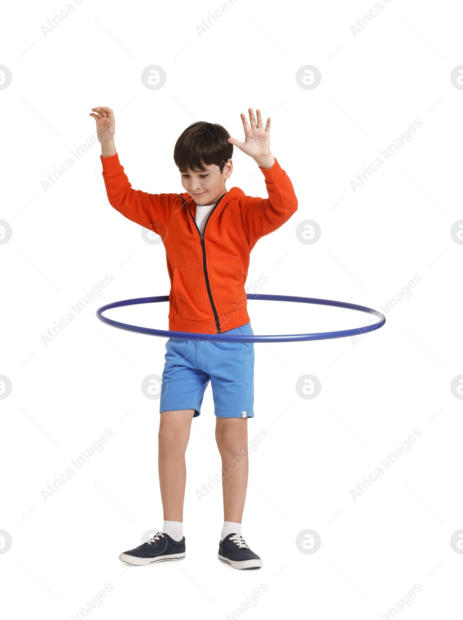 Photo of Boy exercising with hula hoop on white background