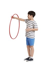 Photo of Boy exercising with hula hoop on white background