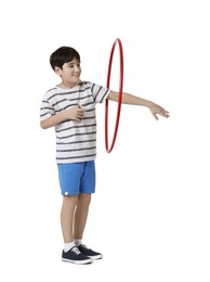 Photo of Boy exercising with hula hoop on white background