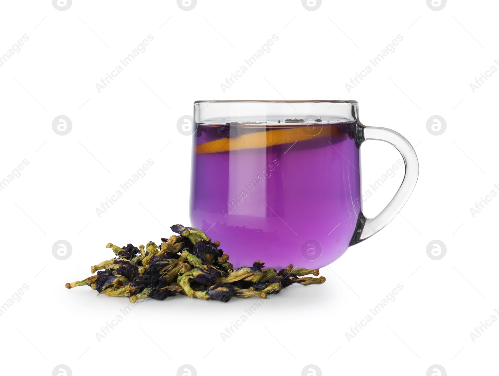 Photo of Delicious butterfly pea flower tea with lemon in glass cup and dry petals isolated on white