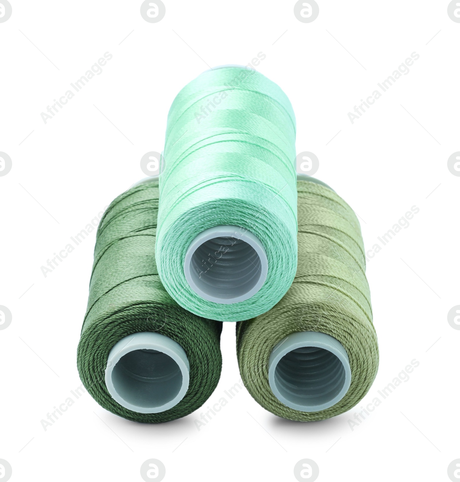 Photo of Spools of colorful sewing threads isolated on white