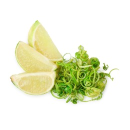 Photo of Lime zest and slices of fresh fruit isolated on white, top view