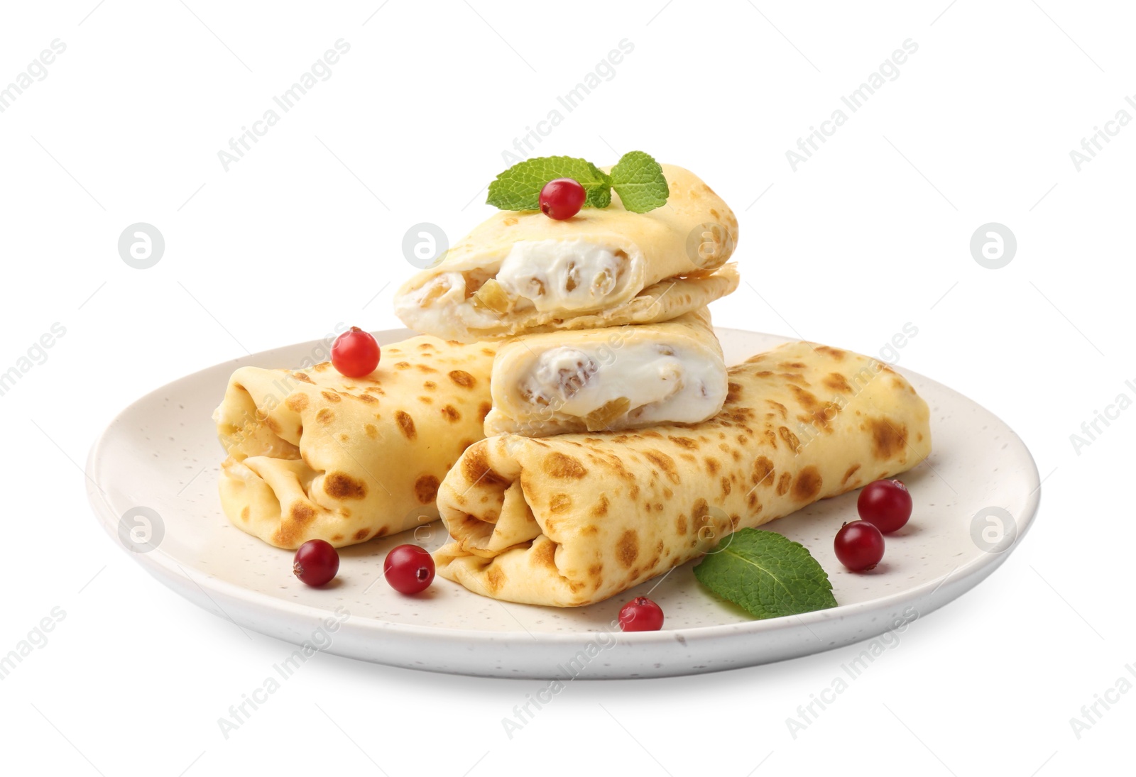 Photo of Delicious rolled crepes with cottage cheese, raisins, cranberries and mint isolated on white