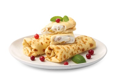 Photo of Delicious rolled crepes with cottage cheese, raisins, cranberries and mint isolated on white