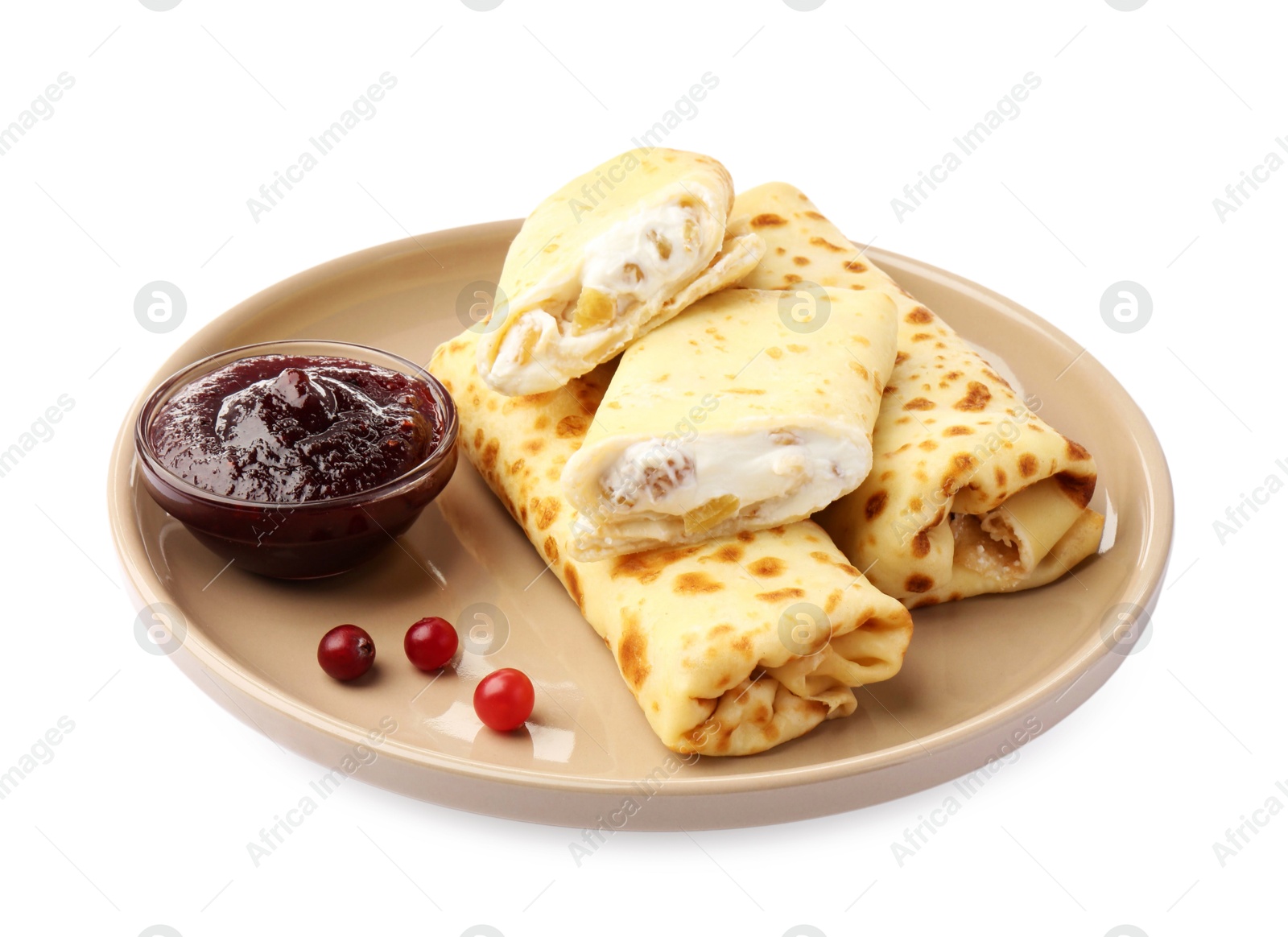 Photo of Delicious rolled crepes with cottage cheese, raisins, jam and cranberries isolated on white