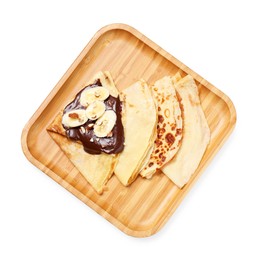 Delicious crepes with chocolate sauce, banana and almonds isolated on white, top view