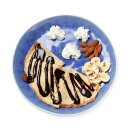 Photo of Delicious crepes with chocolate sauce, banana, almonds and whipped cream isolated on white, top view