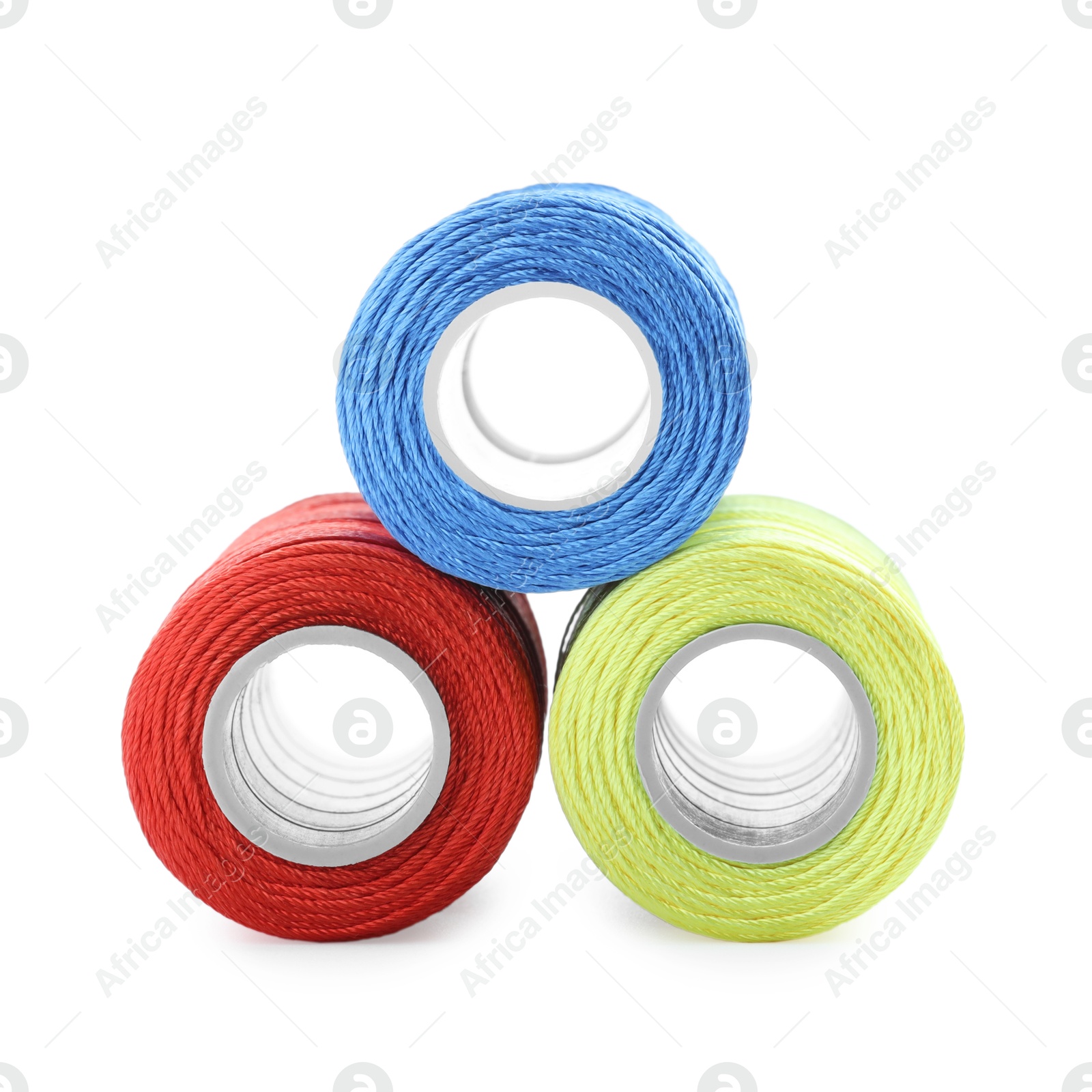 Photo of Spools of bright sewing threads isolated on white