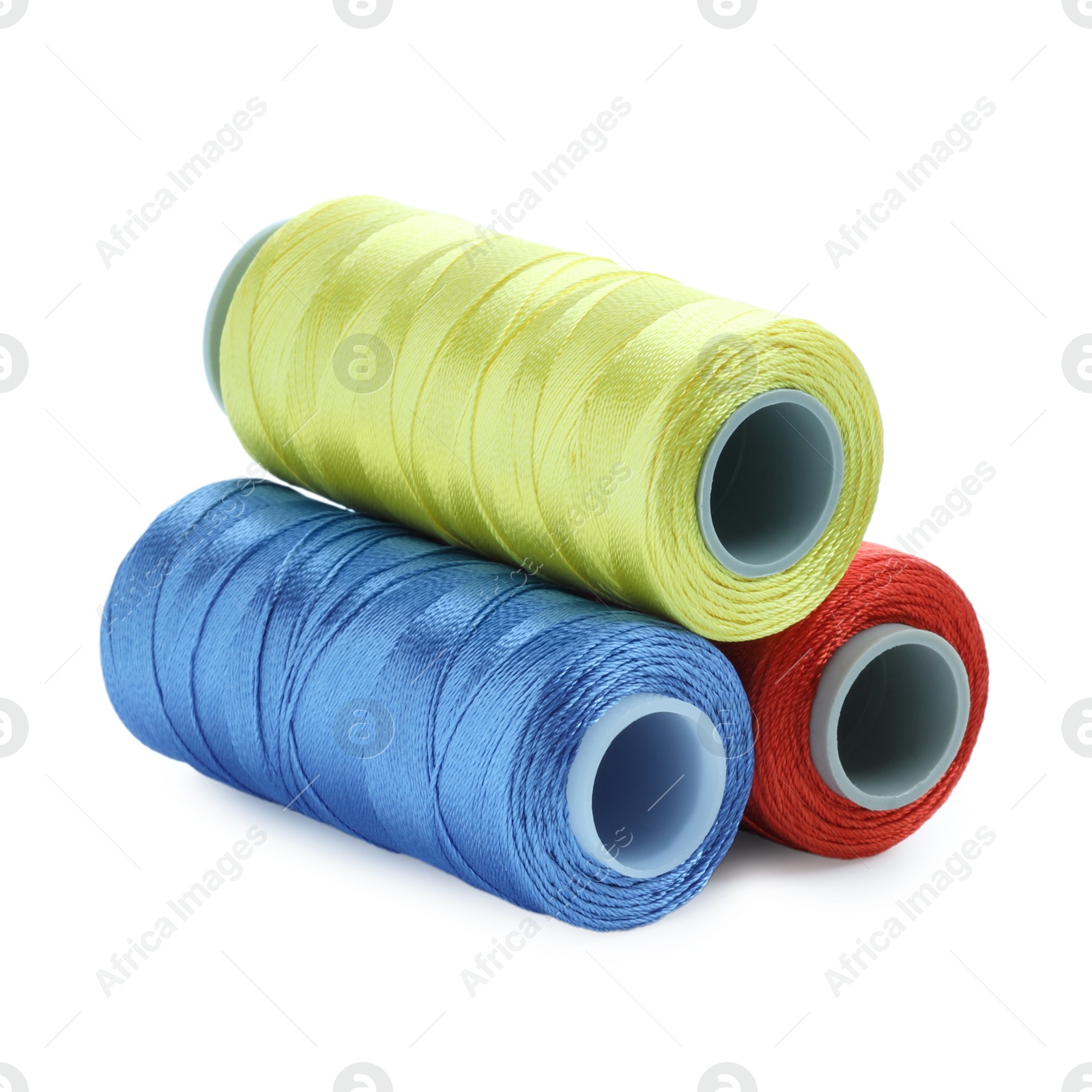 Photo of Spools of bright sewing threads isolated on white