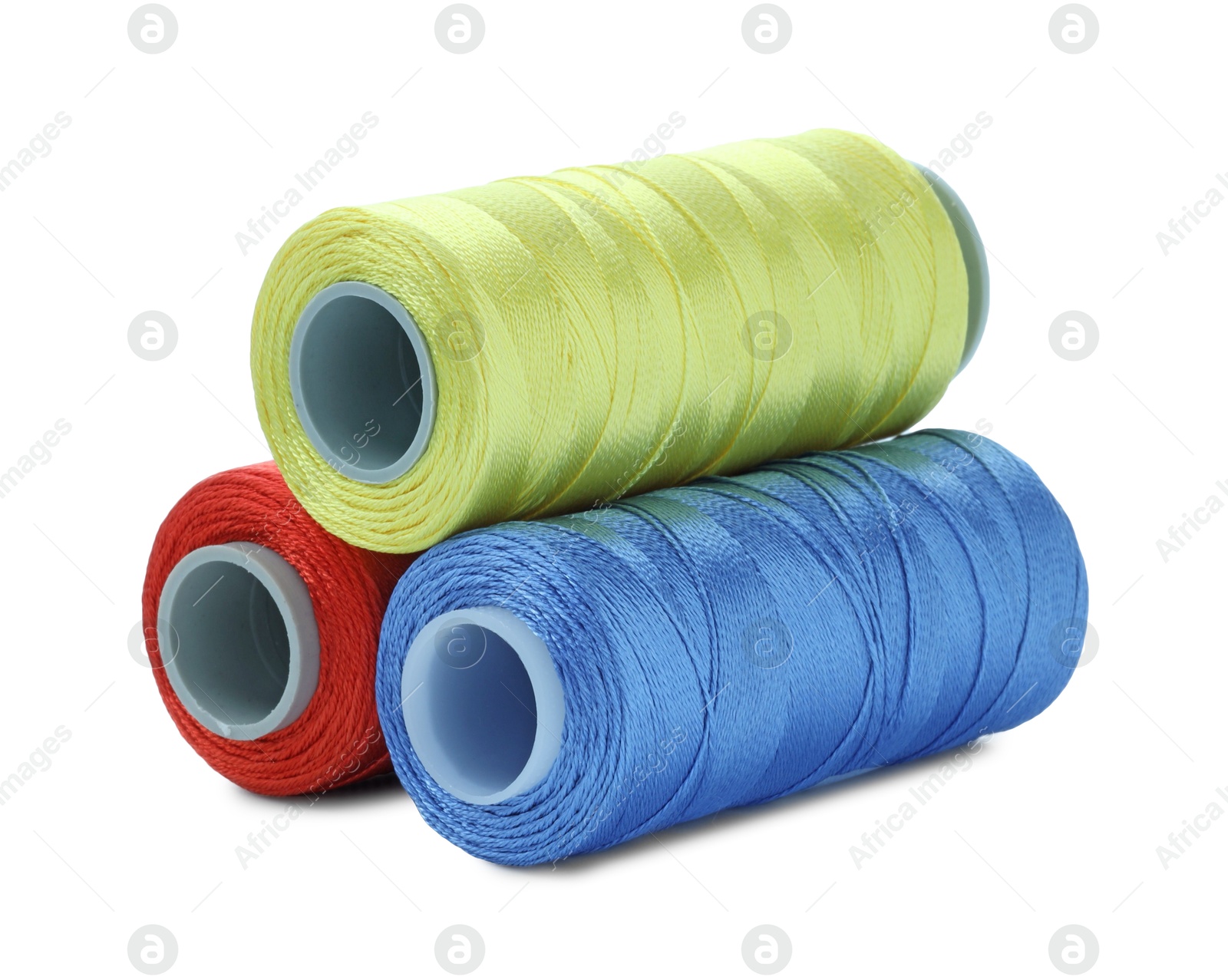 Photo of Spools of bright sewing threads isolated on white