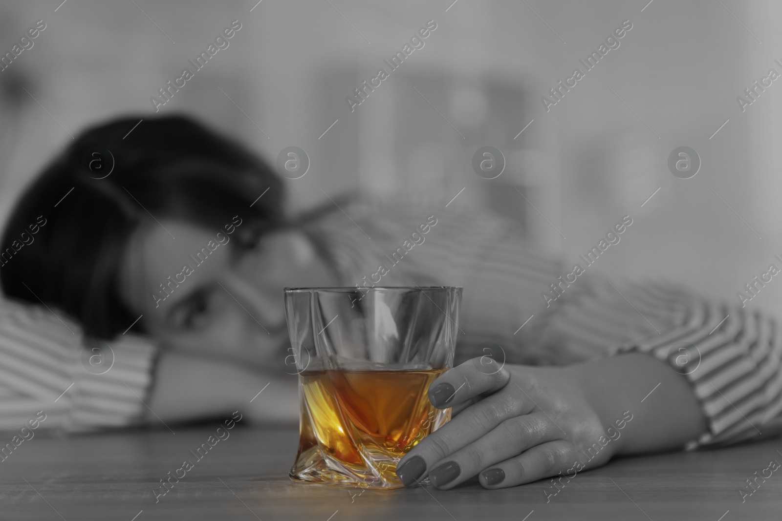 Image of Alcohol addiction. Drunk woman with glass of whiskey, selective focus