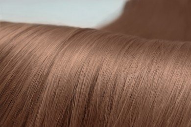 Image of Beautiful hair in mocha mousse shade, closeup. Trendy color of 2025 year