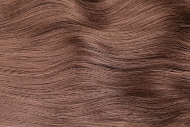 Image of Beautiful hair in mocha mousse shade, closeup. Trendy color of 2025 year