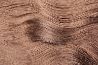 Image of Beautiful hair in mocha mousse shade, closeup. Trendy color of 2025 year