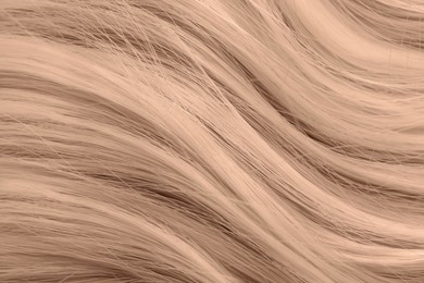 Image of Beautiful hair in mocha mousse shade, closeup. Trendy color of 2025 year