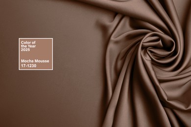 Image of Mocha mousse - color of 2025 year. Silk fabric in brown shade, top view