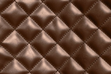 Image of Leather surface in mocha mousse shade with diamond pattern, closeup. Trendy color of 2025 year