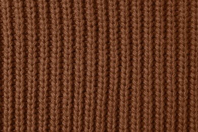 Image of Knitted fabric in mocha mousse shade, closeup. Trendy color of 2025 year