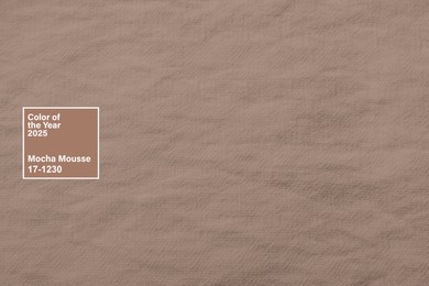 Image of Mocha mousse - color of 2025 year. Fabric in brown shade, closeup