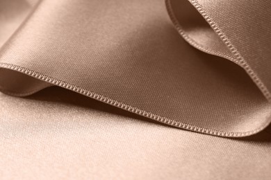 Image of Silk fabric in mocha mousse shade, closeup. Trendy color of 2025 year