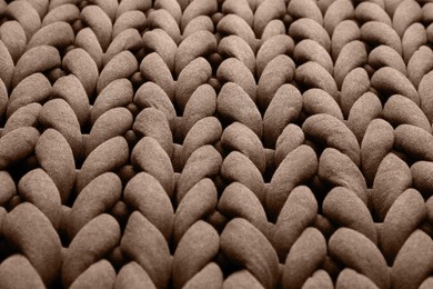 Image of Knitted fabric in mocha mousse shade, closeup. Trendy color of 2025 year