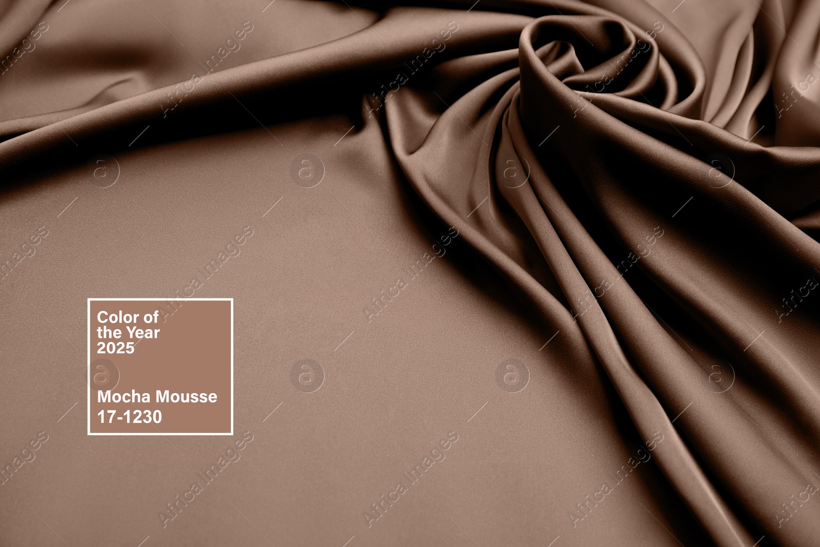 Image of Mocha mousse - color of 2025 year. Silk fabric in brown shade, closeup