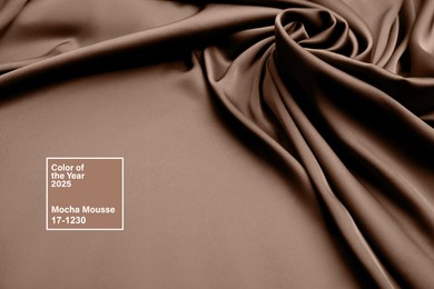 Image of Mocha mousse - color of 2025 year. Silk fabric in brown shade, closeup