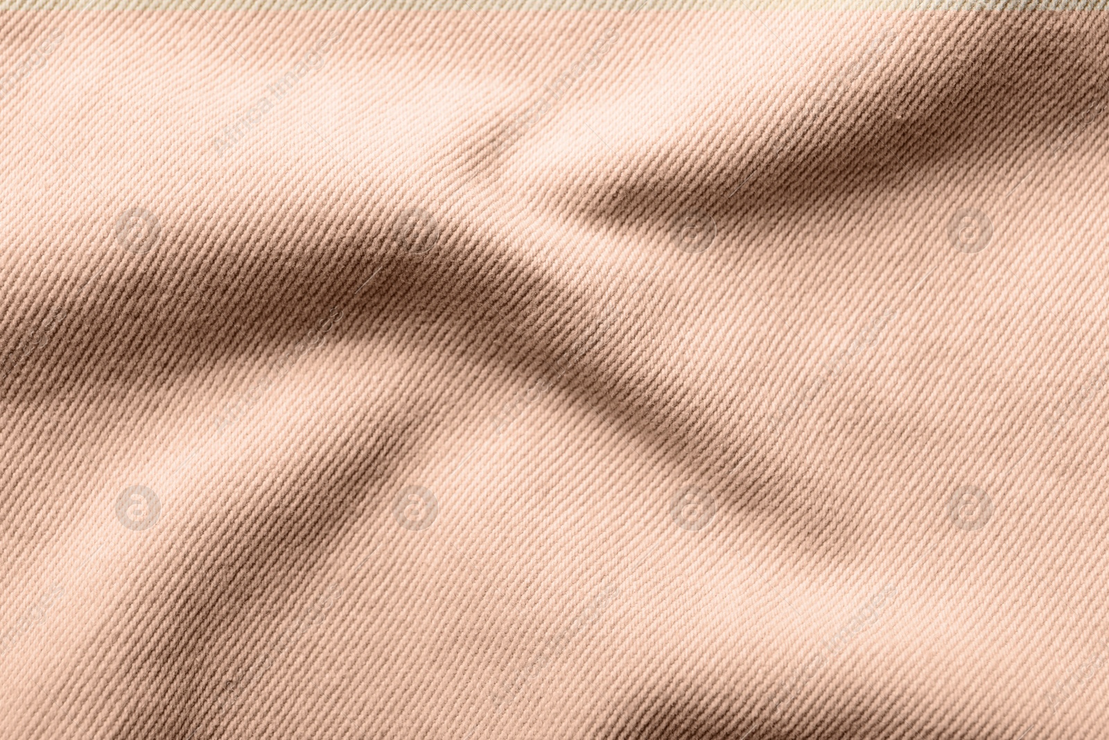 Image of Fabric in mocha mousse shade, closeup. Trendy color of 2025 year